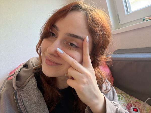 Woman takes playful selfies indoors in Strasbourg