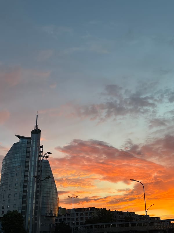 Fiery sunset over Burgas skyline and street level