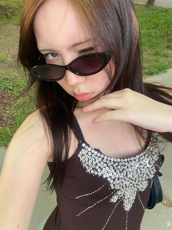 Young woman spotted relaxing with juice box in city