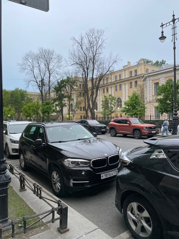 Cars parked on Saint Petersburg street during evening hours