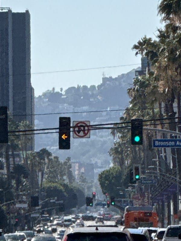 Evening traffic flows through central Los Angeles streets