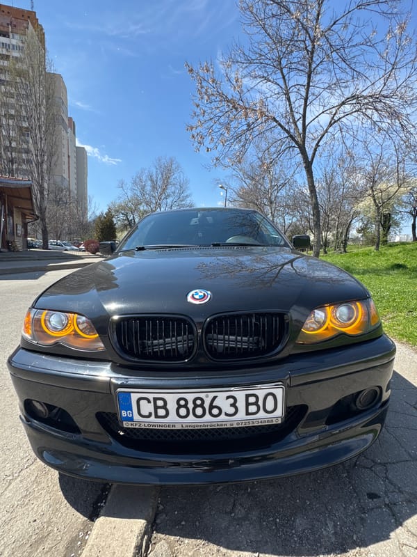 Black BMW parked near CreditX building in Sofia
