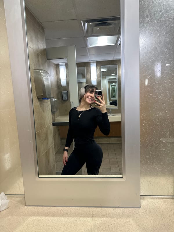 Woman takes selfie in Santa Monica public restroom
