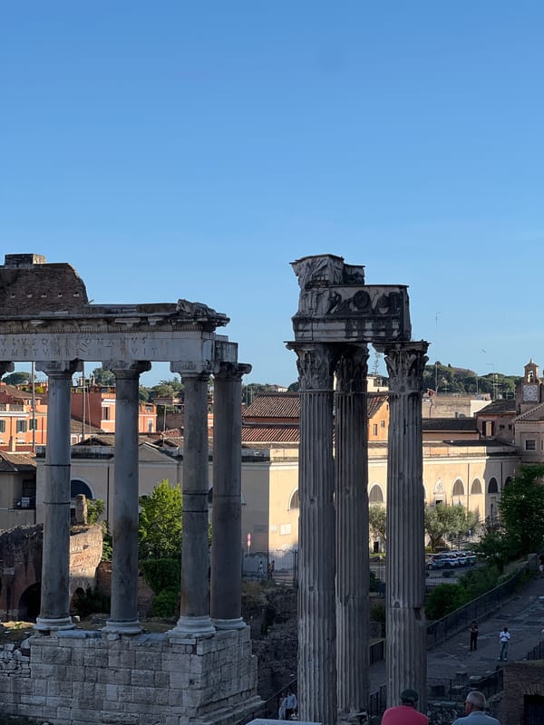 Tourist documents sunny afternoon tour of Roman Forum archaeological sites