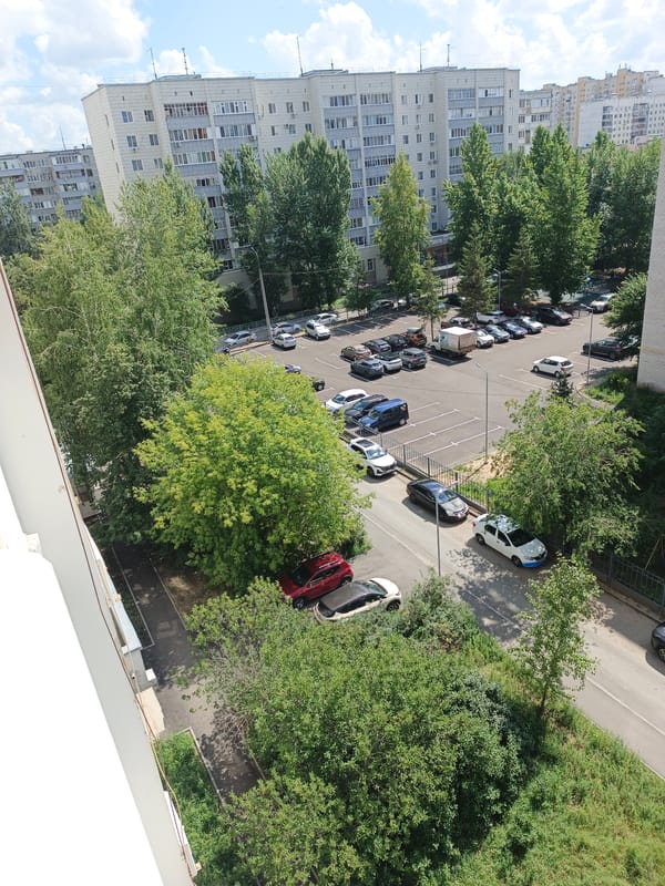 Summer morning inside and outside a Kazan apartment neighborhood