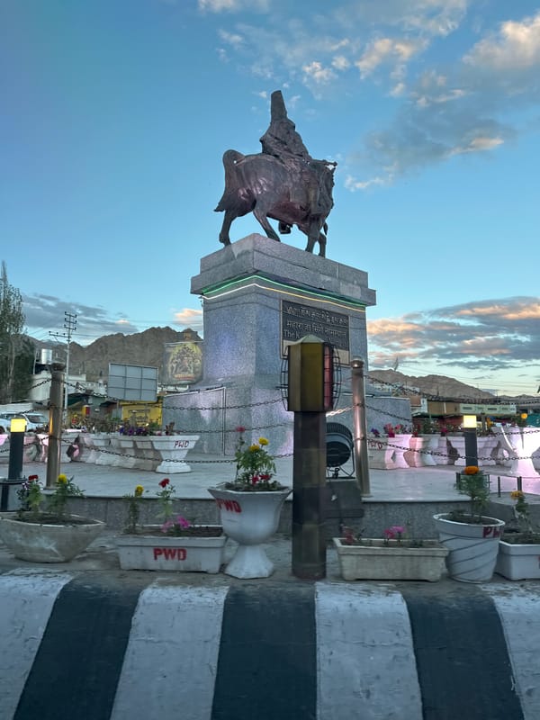 Royal statue and street market life in Leh, India