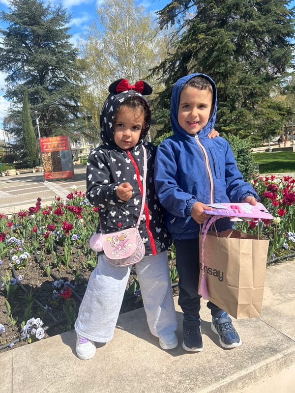 Children visit urban tulip garden during spring bloom