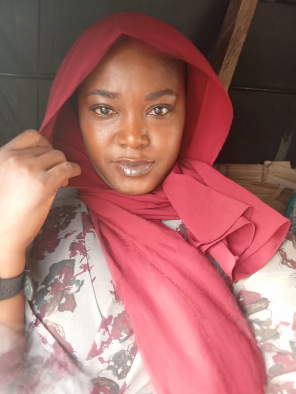 Person in red hijab observed at Nigerian stadium