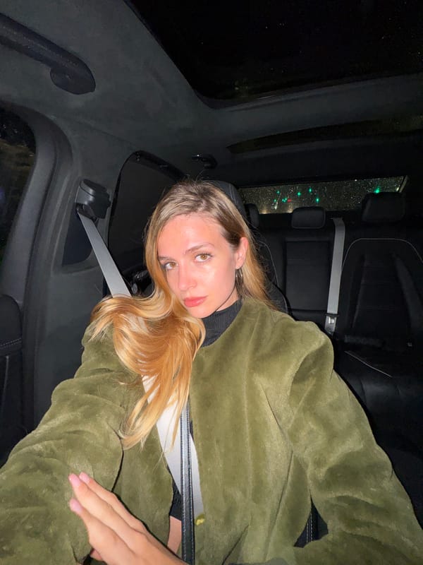 Woman photographed in car backseat in Tbilisi at night
