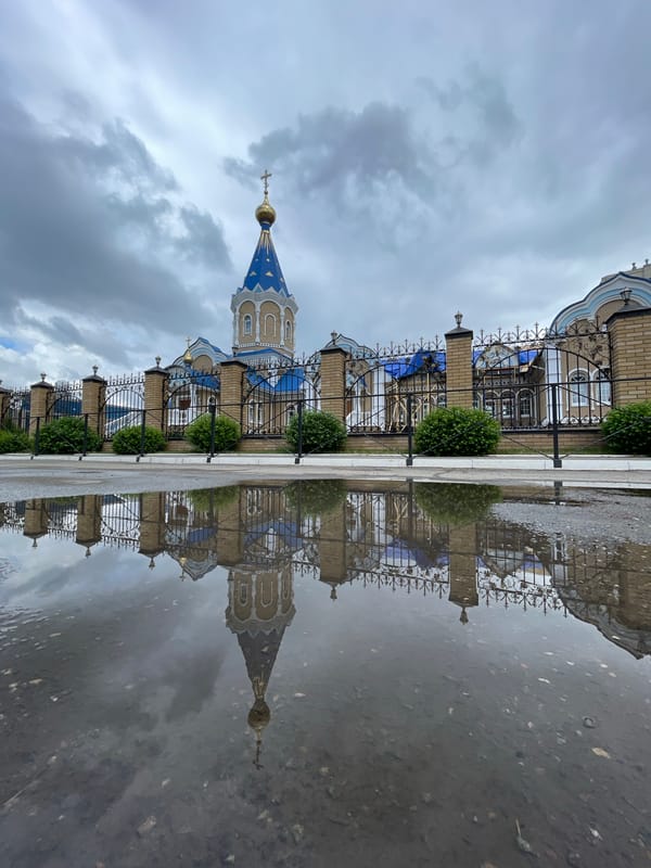 Morning family outing documented near church in Izhevsk, Russia