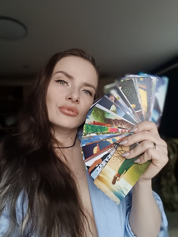 Woman displays colorful illustrated cards in Rusalevka, Russia