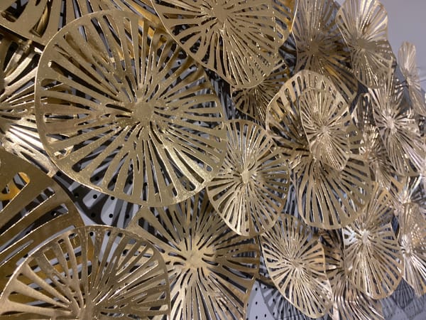 Browsing a Denpasar home decor store, gold accents everywhere