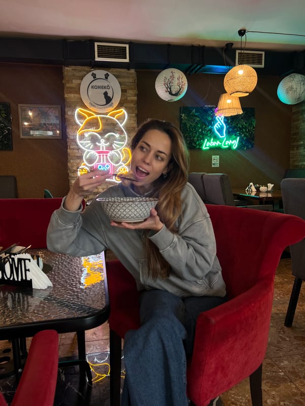 Woman enjoys ramen lunch at Japanese cafe in Podgorica