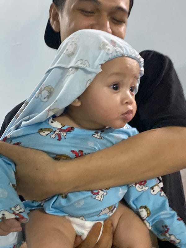 Toddler and Pomeranians at home in Dukuh