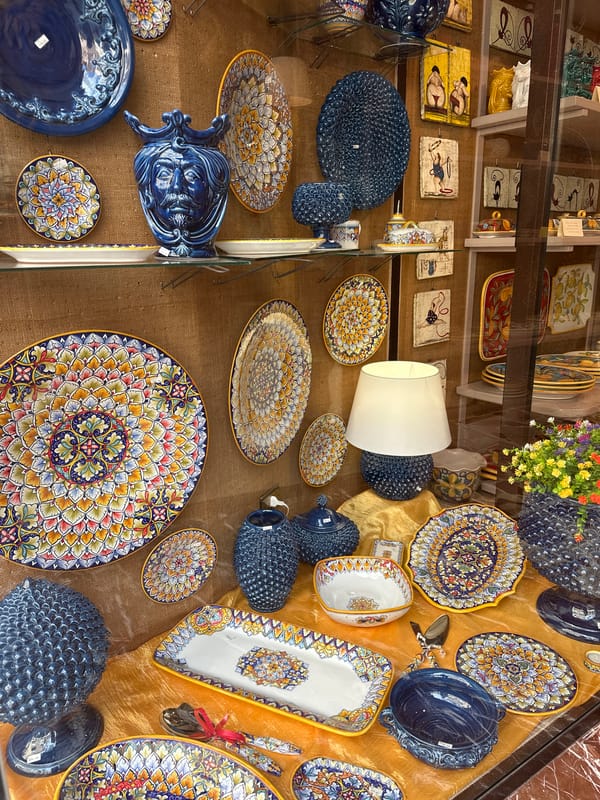 Ceramic pottery display observed in Taormina shop window