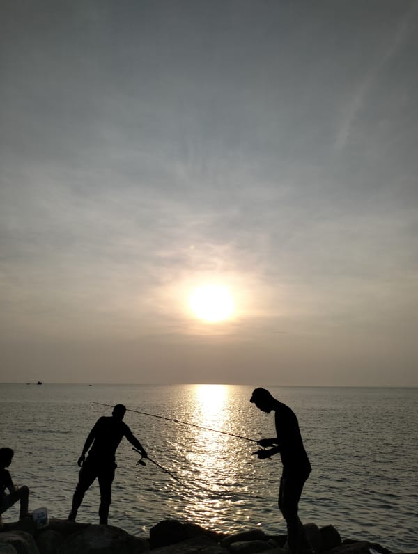 Evening fishing session captured along Lhokseumawe coastline
