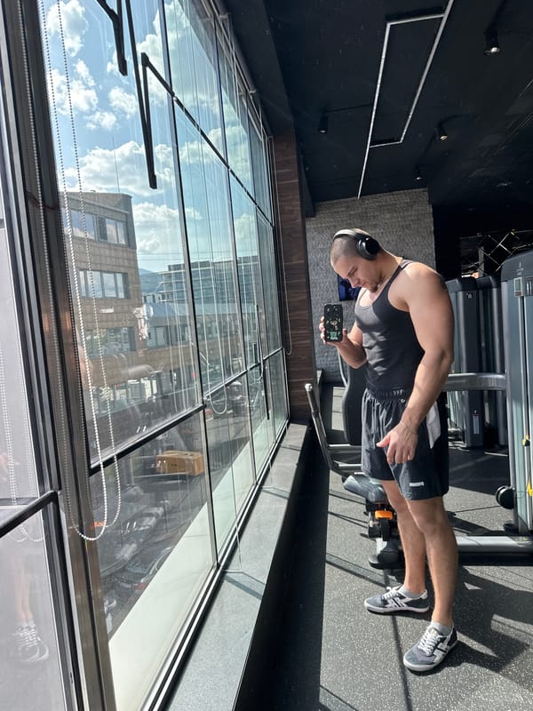 Man checks smartphone at Sofia gym facility