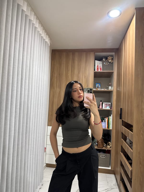 Woman Takes Mirror Selfies at Home in Puebla