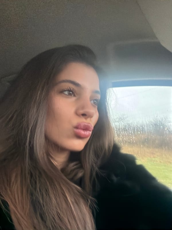 Woman makes pouty face while in vehicle in Bulgaria