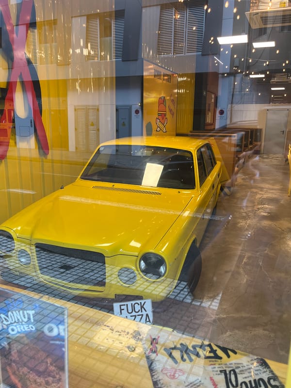 Vintage yellow car spotted in Las Palmas restaurant display