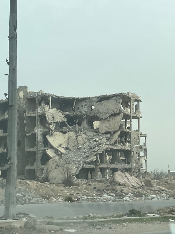 Vehicle journey documents extensive war damage in Damascus suburb