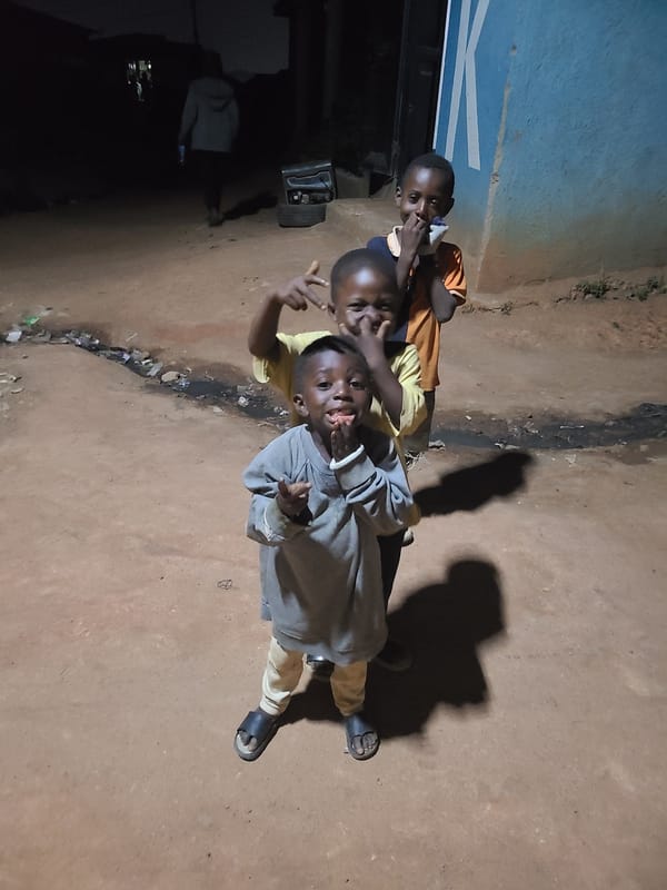 Children pose for photos in Jos, Nigeria streets