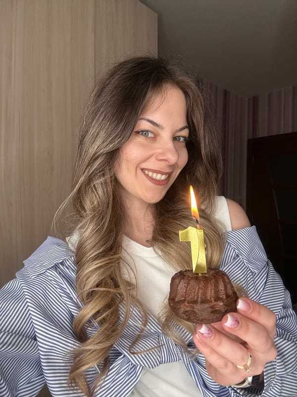 Woman celebrates with candle-topped muffin in Stara Zagora