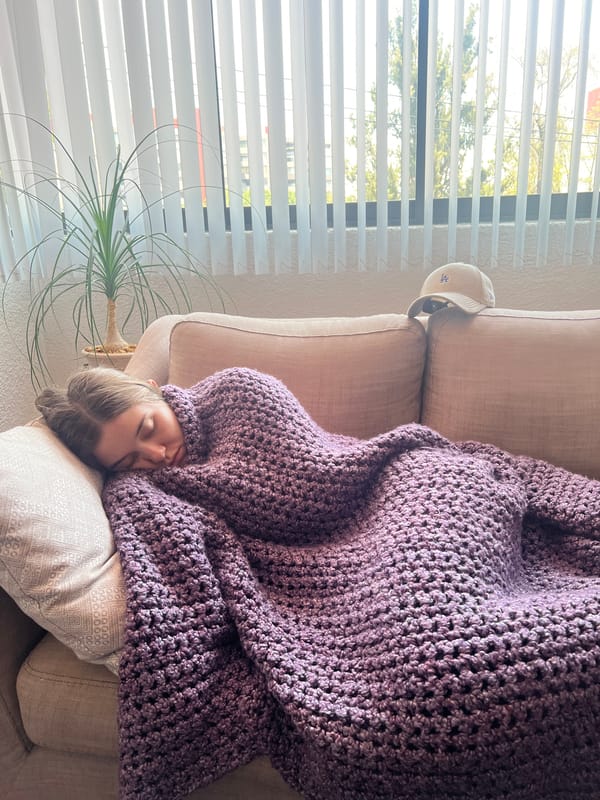 Woman rests on sofa in Mexico City home