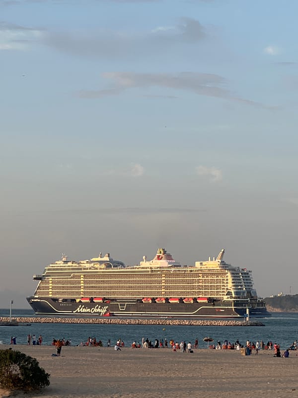 Sunset at Tangier marina as a cruise ship passes by