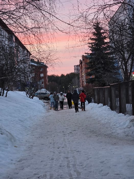 Daily life moments captured across Chaikovsky, Russia winter afternoon
