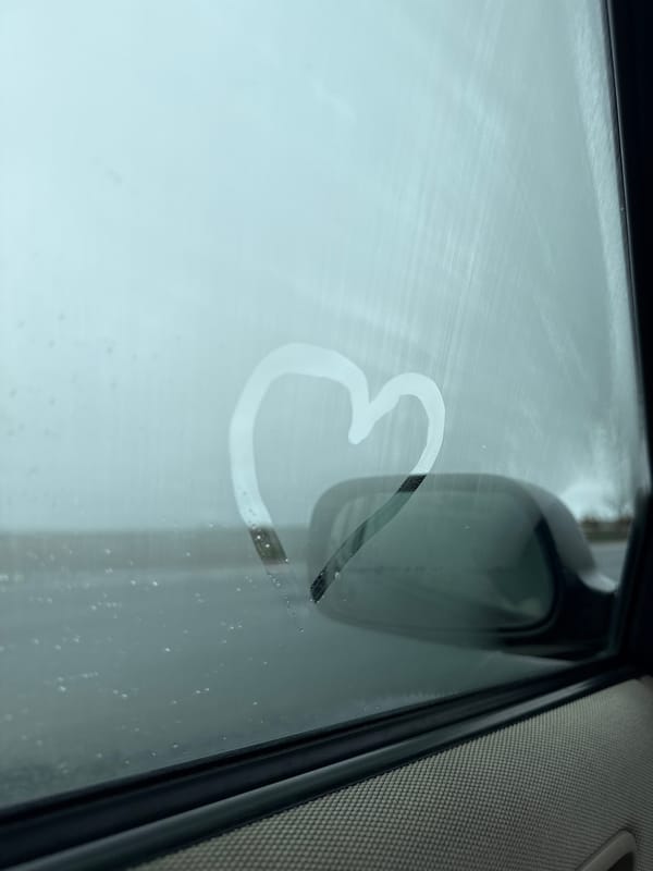 Heart drawn in car window condensation in Lancaster