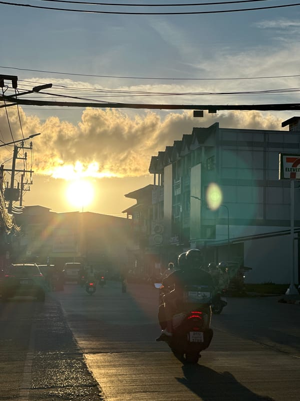 Riding through Koh Phangan streets in warm afternoon light