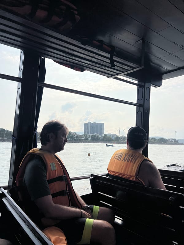 Boat passengers document approach to Nha Trang coastline