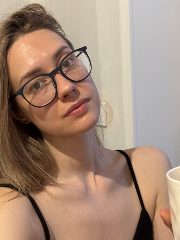 Woman photographed indoors with mug in Chaikovsky, Russia