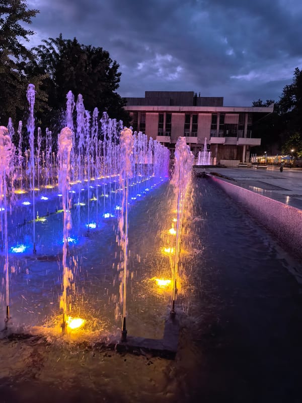 Illuminated fountain displays captured at dusk in Svishtov, Bulgaria