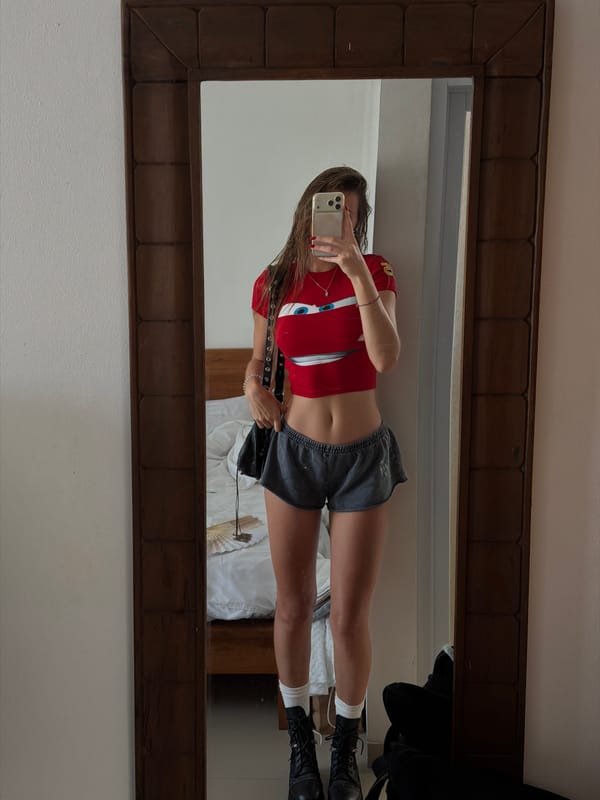 Woman takes mirror selfie in Tibubeneng, Indonesia