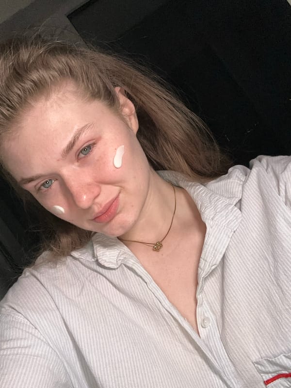 Woman takes selfie in pajamas at home in Kazan