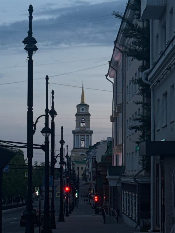 Tourist captures Perm landmarks and street life near cathedral