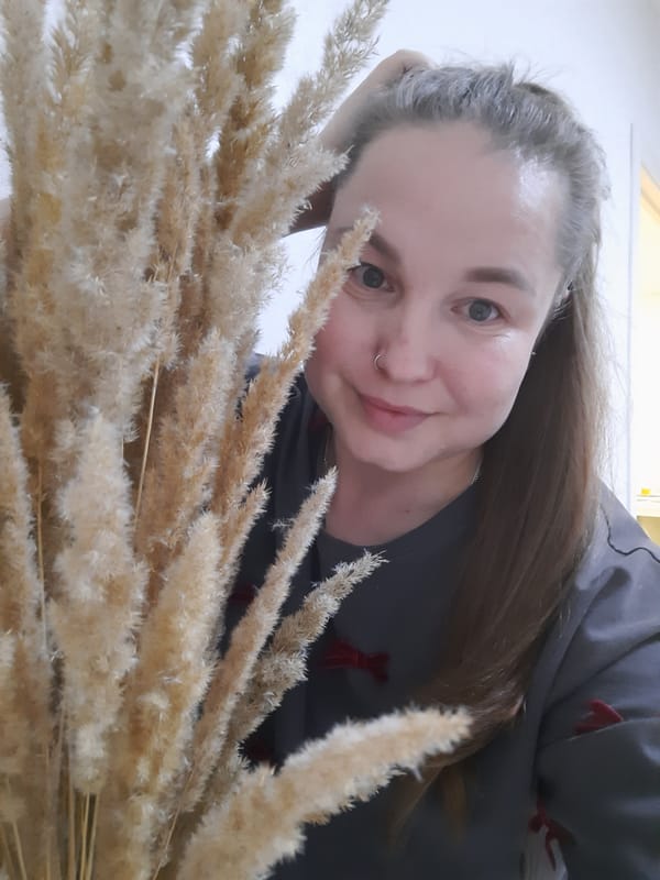 Woman photographed indoors with pampas grass in Pervomaysky