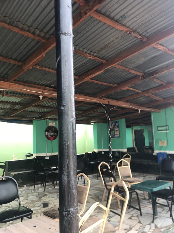 Afternoon social gathering at Nigerian pool hall documented