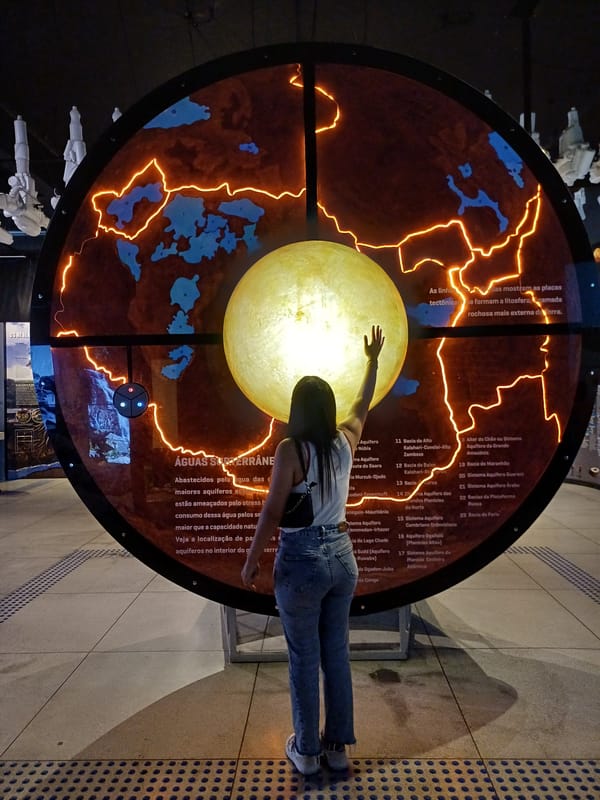 Science museum visitor documents water and earth exhibits in Curitiba