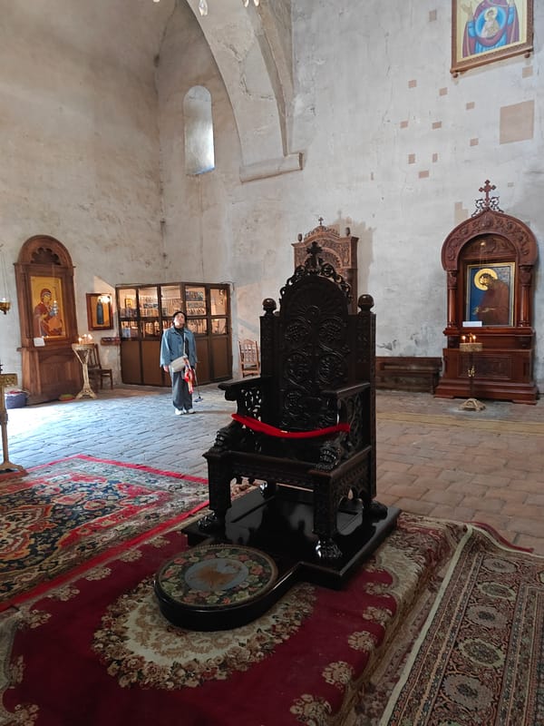 Early morning visitor documents Svetitskhoveli Cathedral interior in Georgia