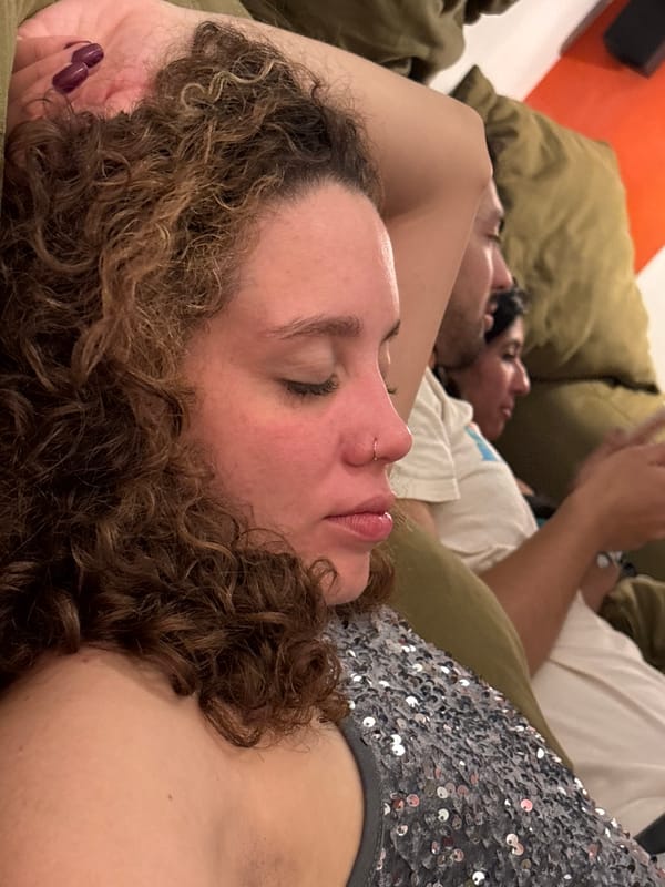 Three people relax on couch in early morning São Paulo