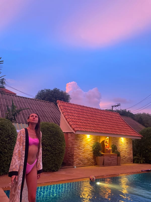Rawai villa at dusk: poolside scenes and Hindu-Buddhist statuary