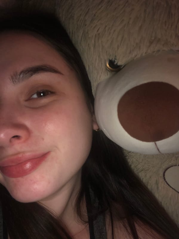 Woman resting with teddy bear captured in Noviy, Russia