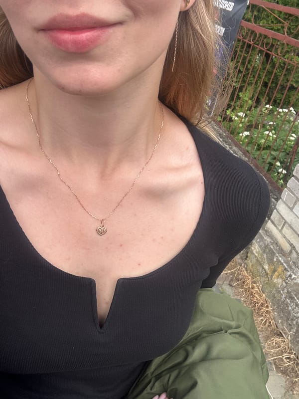 Woman Takes Selfies While Walking in Kozova, Ukraine