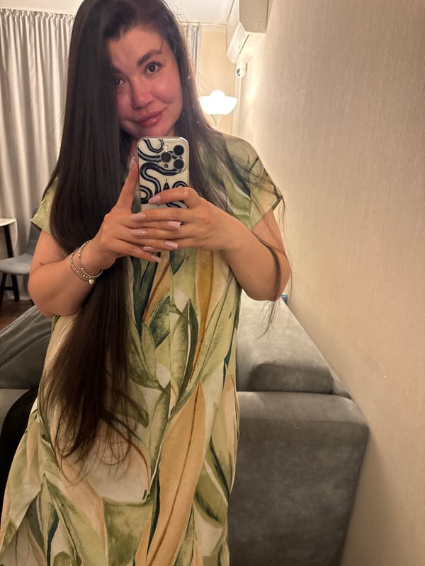 Woman takes selfies indoors in Votkinsk, Russia