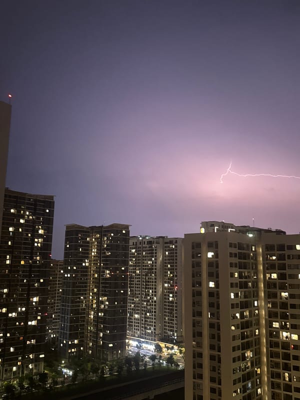 Nighttime apartment buildings illuminated in Thủ Đức, Vietnam