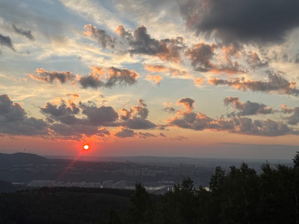 Summer solstice sunset over Krasnoyarsk from a hilltop overlook