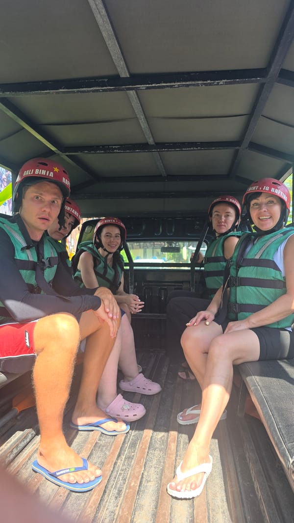 Group travels in open-air vehicle through Ubud District